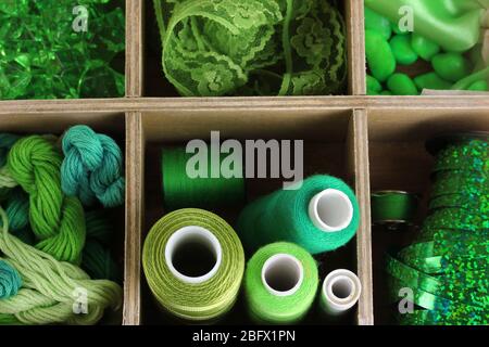 Green thread and material for handicrafts in box close-up Stock Photo