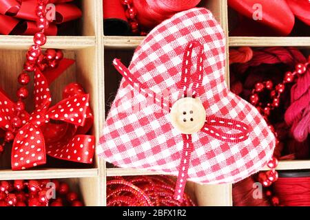 Red thread and material for handicrafts in box close-up Stock Photo