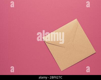 Pastel pink toilet paper on bright color block background Stock