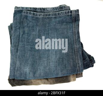Stack fashion jeans close-up isolated on white Stock Photo