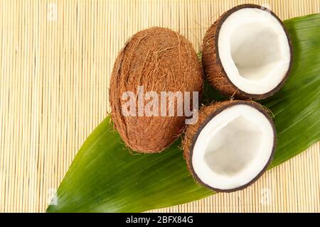 coconuts on a beige wicker mst close-up Stock Photo