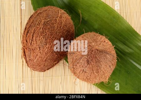 coconuts on a beige wicker mst close-up Stock Photo