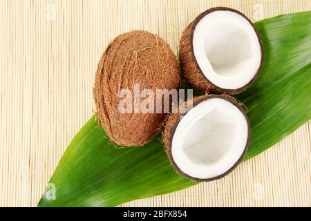 coconuts on a beige wicker mst close-up Stock Photo