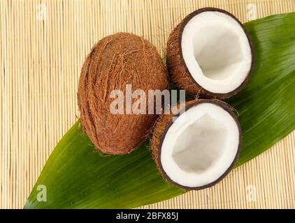 coconuts on a beige wicker mst close-up Stock Photo