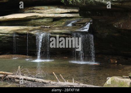 Old man cave walk trail and water fall in Ohio State,nature green landscape and green trees wood suspension bridge,water canal Stock Photo