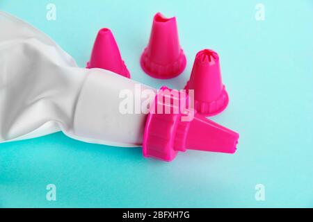 confectionery bag and replaceable nozzles, on blue background Stock Photo