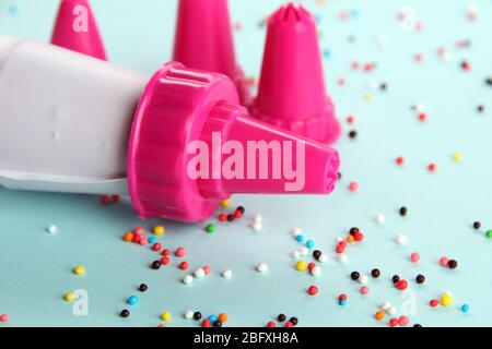 confectionery bag and replaceable nozzles, on blue background Stock Photo