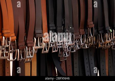 Leather men belts with buckles for sale. Stock Photo