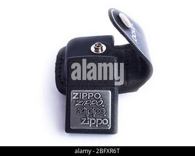 Zippo lighter with black leather case isolated on white. Moscow, Russia - March 2019. Stock Photo