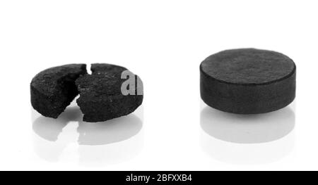 activated carbon in tablets isolated on white Stock Photo