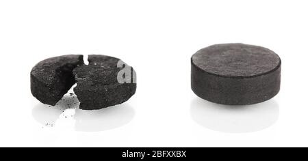 activated carbon in tablets isolated on white Stock Photo