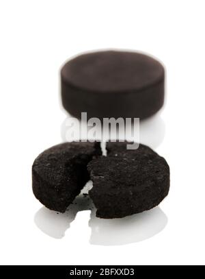 activated carbon in tablets isolated on white Stock Photo