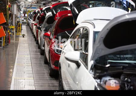 A line of cars on a car assembly line at the Vauxhall car factory during preparedness tests and redesign ahead of re-opening following the COVID-19 outbreak. Located in Ellesmere Port, Wirral, the factory opened in 1962 and currently employs around 1100 workers. It ceased production on 17 March 2020 and will only resume work upon the advice of the UK Government, which will involve stringent physical distancing measures being in place across the site.
