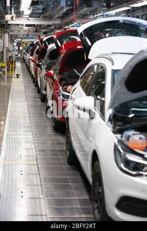 A line of cars on a car assembly line at the Vauxhall car factory during preparedness tests and redesign ahead of re-opening following the COVID-19 outbreak. Located in Ellesmere Port, Wirral, the factory opened in 1962 and currently employs around 1100 workers. It ceased production on 17 March 2020 and will only resume work upon the advice of the UK Government, which will involve stringent physical distancing measures being in place across the site.