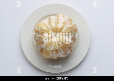 Freshly peeled Pomelo or known as Citrus maxima, Citrus grandis isolated on white background Stock Photo