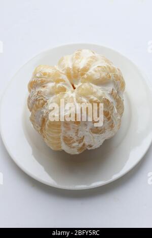 Freshly peeled Pomelo or known as Citrus maxima, Citrus grandis isolated on white background Stock Photo