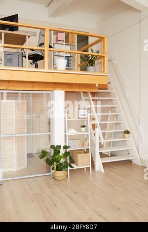 Vertical background image of modern two level apartment with minimal design and wooden details, copy space Stock Photo