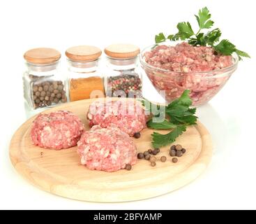 Raw meatballs with spices isolated on white Stock Photo