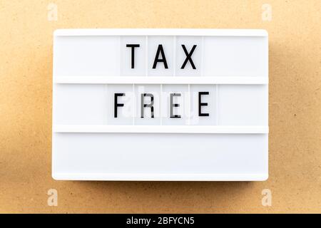 Light box with word tax free on wood background Stock Photo