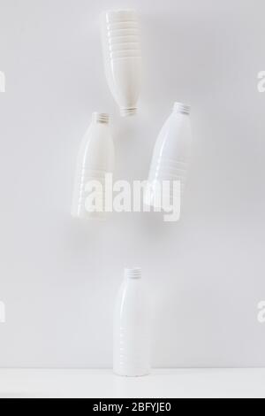 Minimal composition of white plastic bottles on white background, waste sorting and recycling concept, copy space Stock Photo