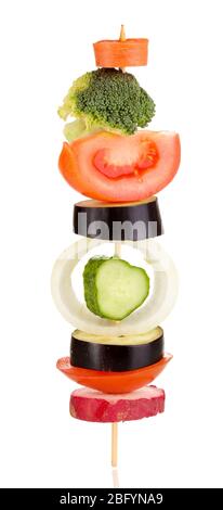 Sliced vegetables on wooden pick isolated on white Stock Photo