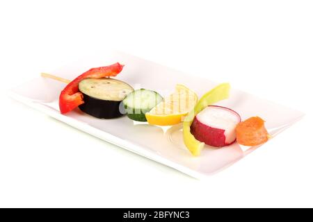 Sliced vegetables on wooden pick isolated on white Stock Photo
