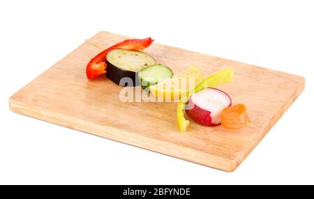 Sliced vegetables on wooden pick isolated on white Stock Photo