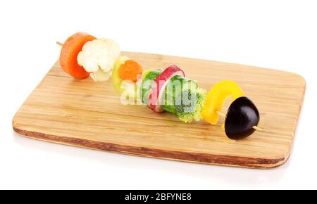 Sliced vegetables on wooden pick isolated on white Stock Photo