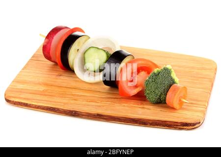 Sliced vegetables on wooden pick isolated on white Stock Photo