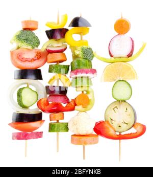 Sliced vegetables on wooden pick isolated on white Stock Photo