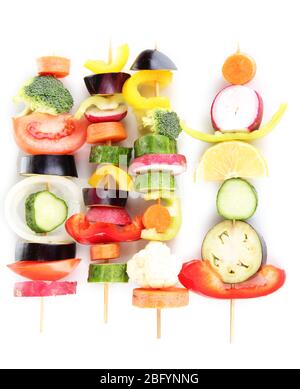 Sliced vegetables on wooden pick isolated on white Stock Photo