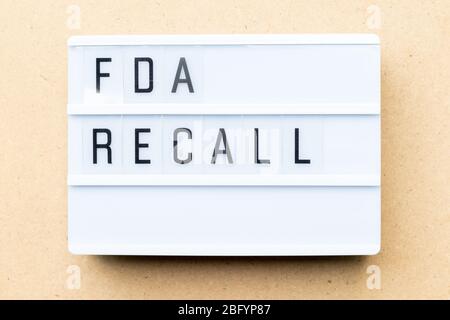 White lightbox with word fda recall on wood background Stock Photo