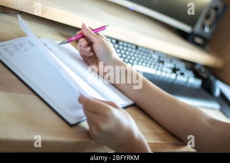 Female hands using computer. Female office desk workspace homeoffice mock up with computer. Online school for sudents Stock Photo