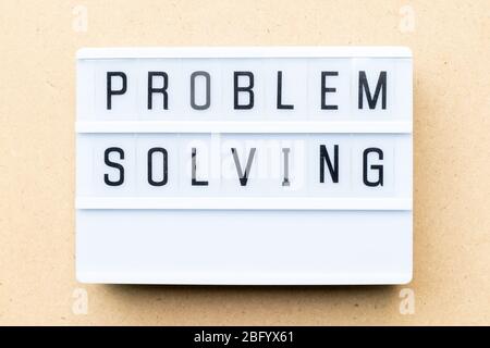 White lightbox with word problem solving on wood background Stock Photo