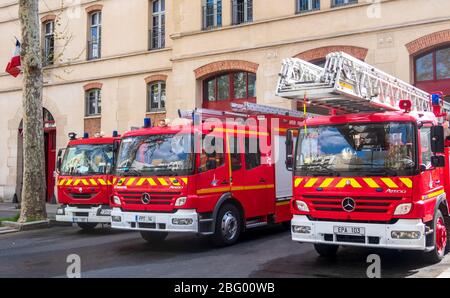 Red fire trucks of the Paris Fire Brigade - France Stock Photo