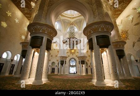 Image ©Licensed to Parsons Media. 20/07/2009. Abu Dhabi, United Kingdom. Tourist walk on the worlds largest carpet inside The Grand Zayed Mosque in Abu Dhabi the capital of the United  Arab Emirates , it is the largest mosque in the United Arab Emirates and the sixth largest mosque in the world. It is named after Sheikh Zayed bin Sultan Al Nahyan, the founder and the first President of the United Arab Emirates, who is also buried there. The mosque was officially opened in the Islamic month of Ramadan in 2007, It changes colour depending on the moon circle.Picture by Andrew Parsons / Parsons Me Stock Photo