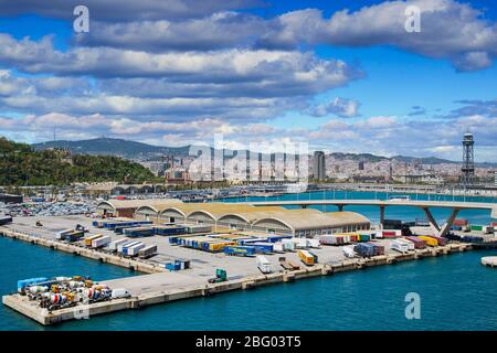 Freight, containers and trucks at the industrial shipping harbor in Barcelona, Spain Stock Photo