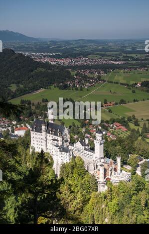 View from the ascend to the Tegelberg on Neuschwanstein Castle, in the background right of the Forggensee, on the left Füssen, Schwangau near Füssen, Stock Photo