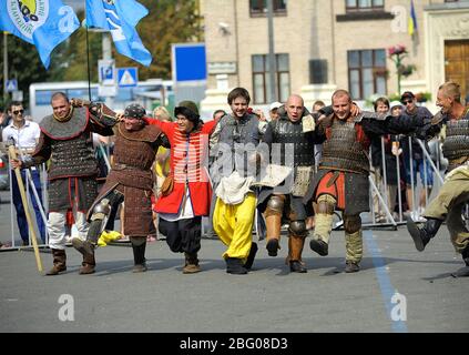 Reenactors dressed in armor of an Old Russian footmen dancing after fight reconstruction Stock Photo