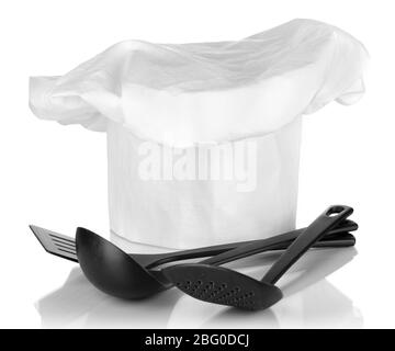 Chef's hat with spoons isolated on white Stock Photo