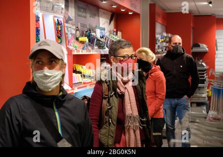 Leipzig, Germany. 20th Apr, 2020. Customers of a stationery shop with mouthguard. As of Monday (20.04.2020), mouthguards are mandatory in public transport and shops in Saxony. Credit: Sebastian Willnow/dpa-Zentralbild/dpa/Alamy Live News Stock Photo