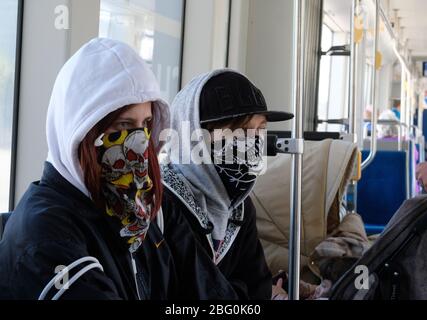 Leipzig, Germany. 20th Apr, 2020. Passengers of a tram wear mouth protection. From Monday (20.04.2020) mouthguards will be compulsory in public transport and shops in Saxony. Credit: Sebastian Willnow/dpa-Zentralbild/dpa/Alamy Live News Stock Photo