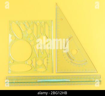 Transparent Yellow Triangle Ruler Yellow straight and triangle plastic ruler on white background Stock ...