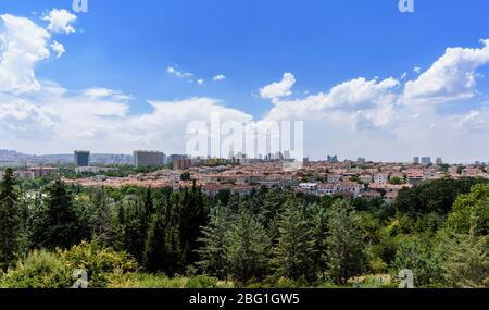 Ankara, Turkey - July 24, 2018: View above of Ankara houses with tiled roofs and skyscrapers Stock Photo