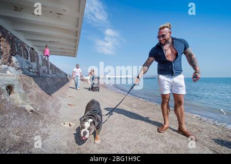 Dog walkers on Paignton seafront during the Coronavirus lockdown, UK Stock Photo