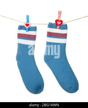 Colorful socks hanging on clothesline, isolated on white Stock Photo