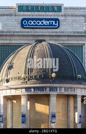 A boarded up Brixton Academy with a message on the exterior supporting the NHS, during the London lockdown due to the spread of Covid-19, 1 April 2020 Stock Photo