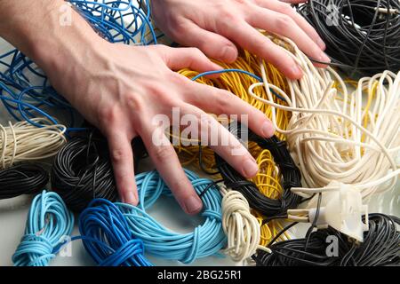 Cables and man hands, close up Stock Photo
