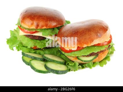 Big and tasty hamburgers on plate isolated on white Stock Photo