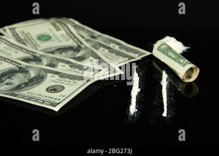 Cocaine drugs heap and lines on  mirror with rolled banknote, close up Stock Photo